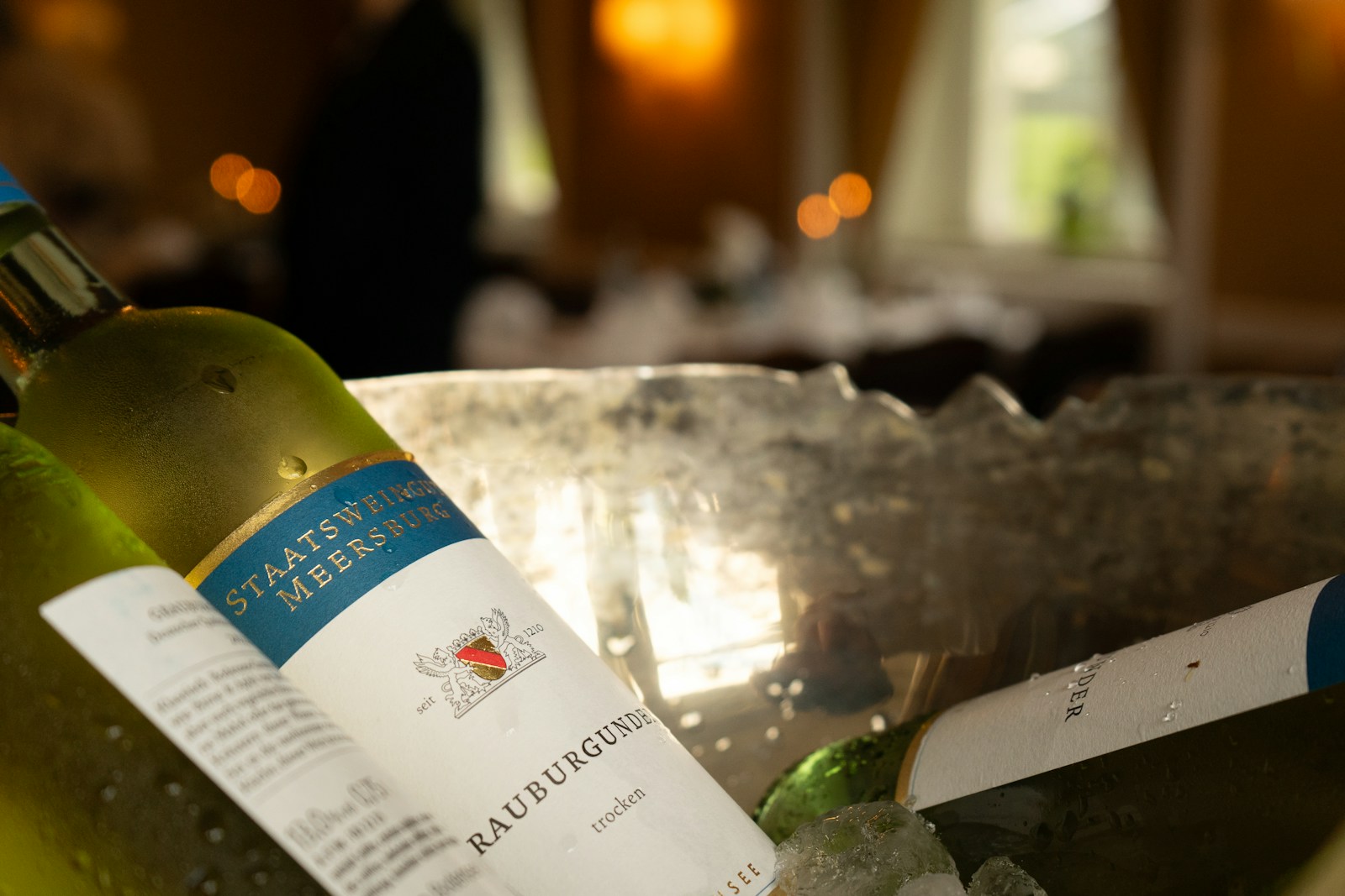 A couple of bottles of wine sitting on top of a table