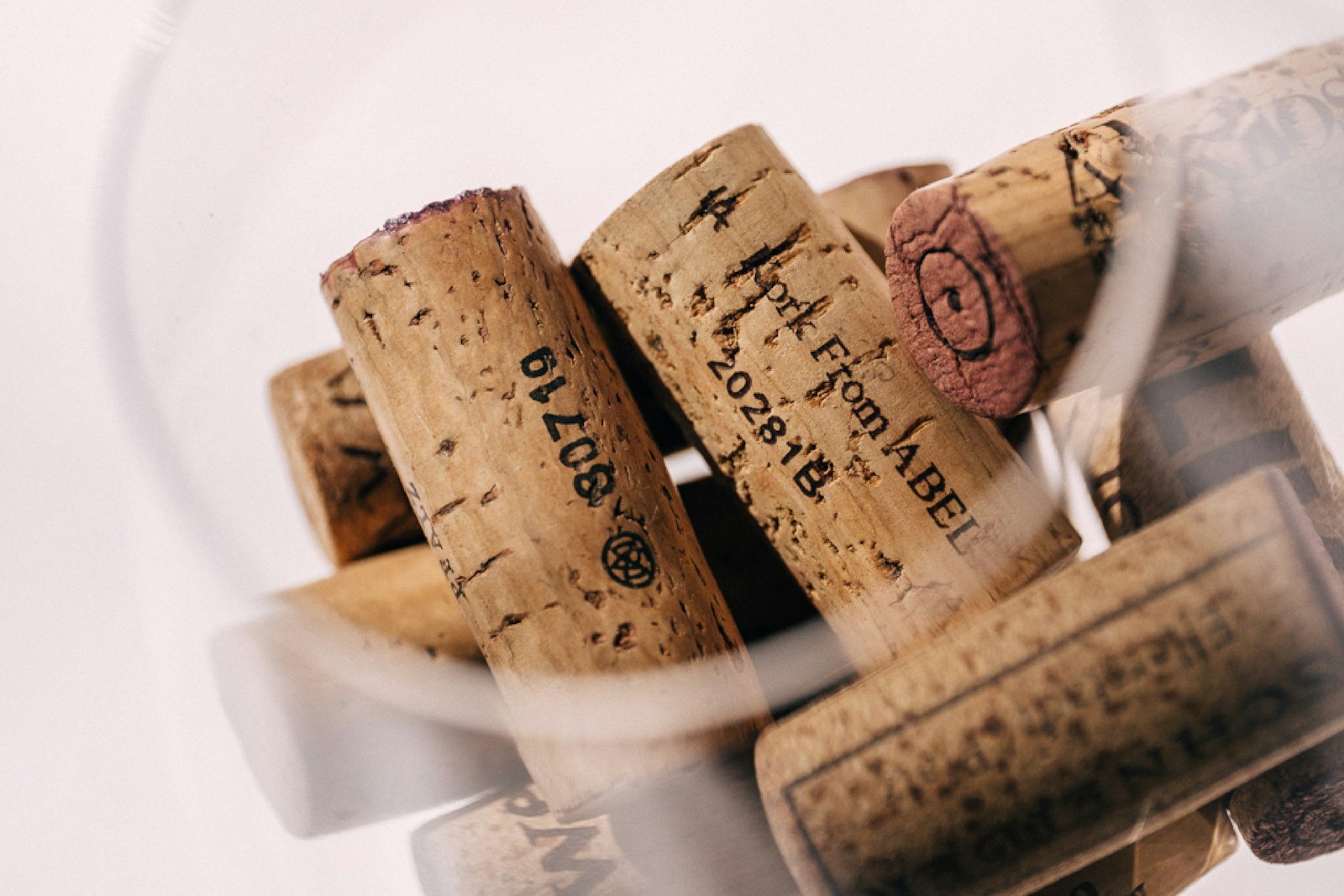 A bunch of wine corks in a wine glass